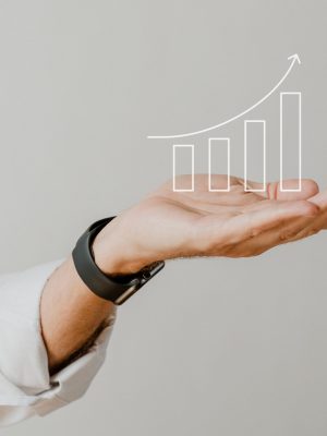 Digital increasing bar graph with businessman hand overlay